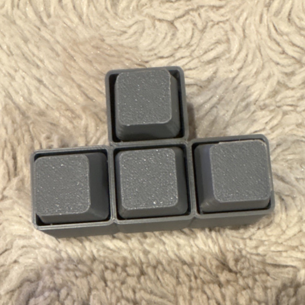 3-D printed grey WASD fidget keys
