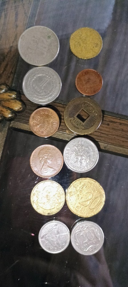 foreign coins lot 2 dozen assorted pieces.