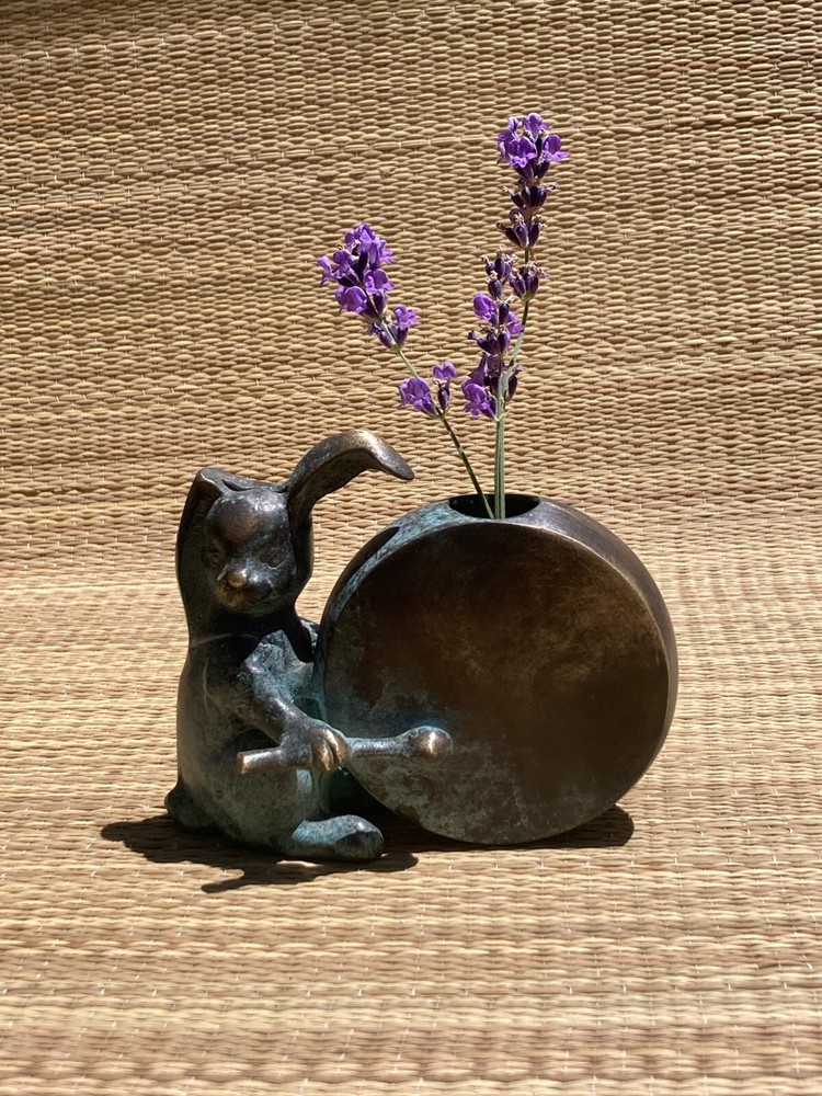 Bunny Vase drumming on a drum