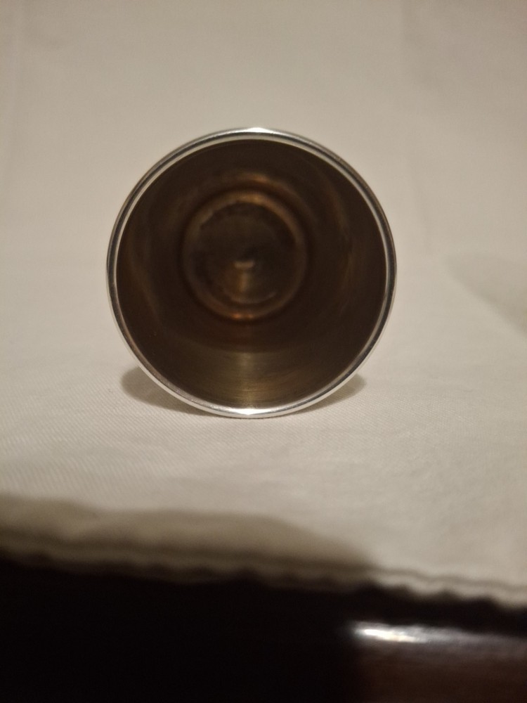 Sterling silver, shot jigger shape like oversized thimble.