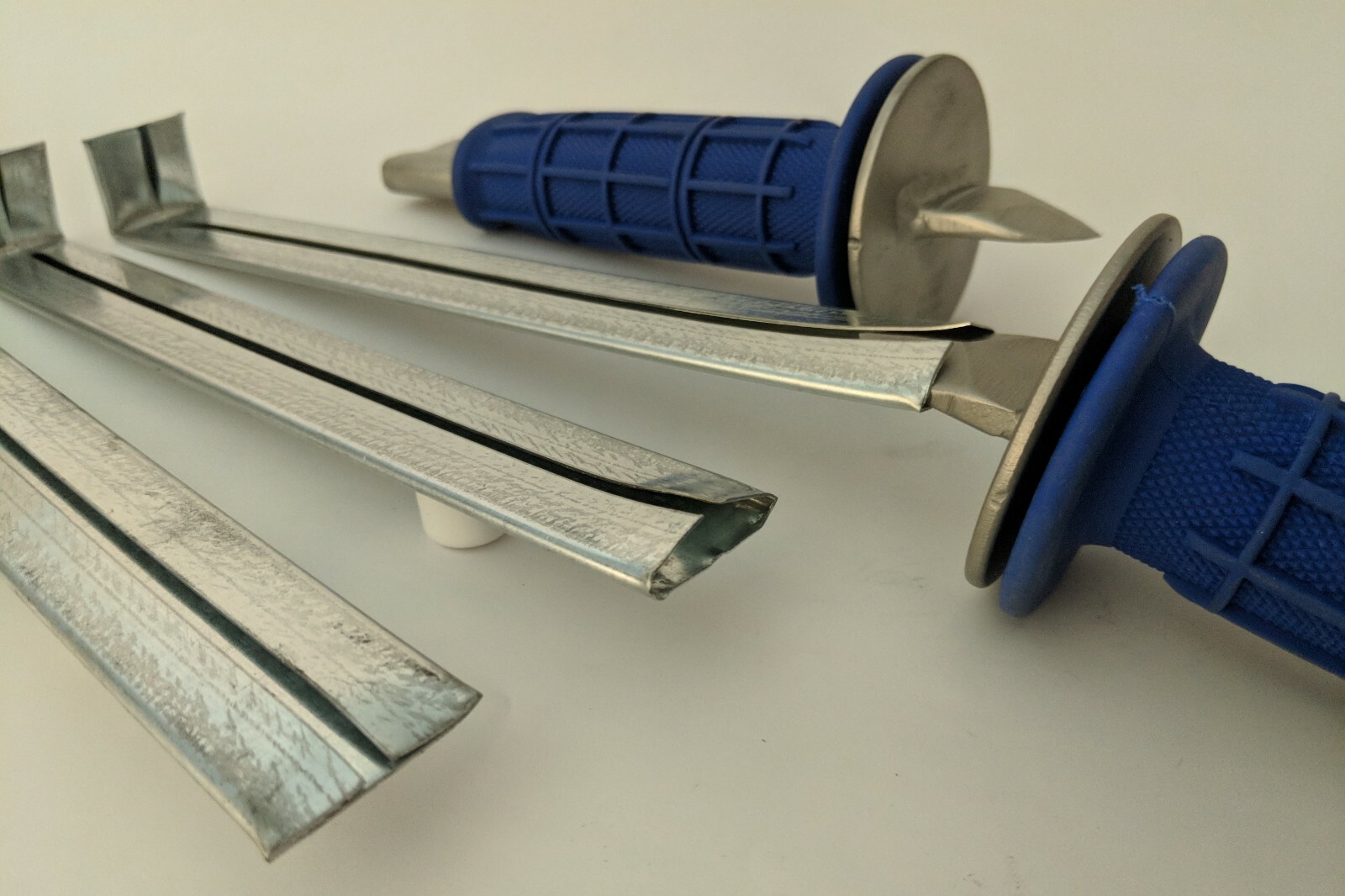 Drive cleat tool in Blue, Red, Gray, Green and Whit.