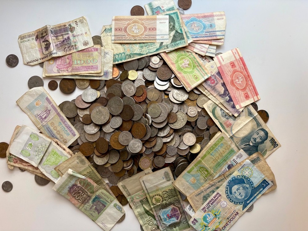 25 foreign coins, 5 foreign banknotes, no duplicates