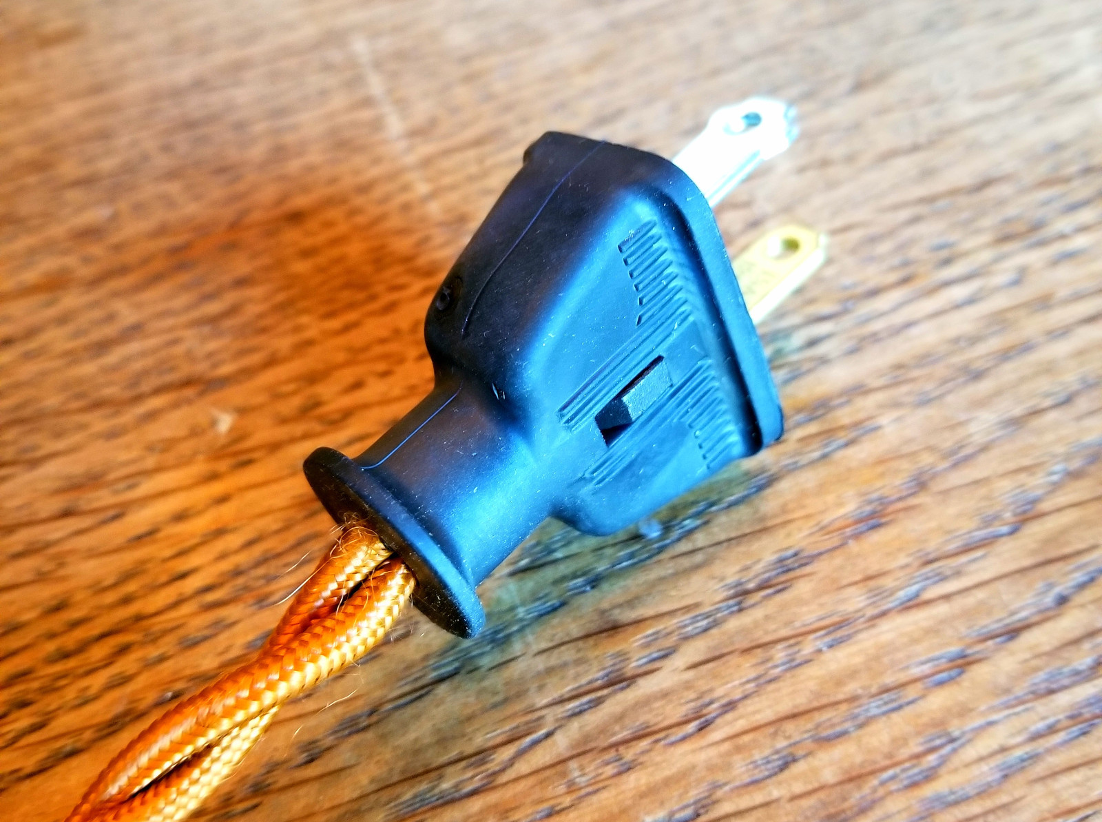 2 Prong Electrical Plug - Black rubber shell, polarized male plug connector