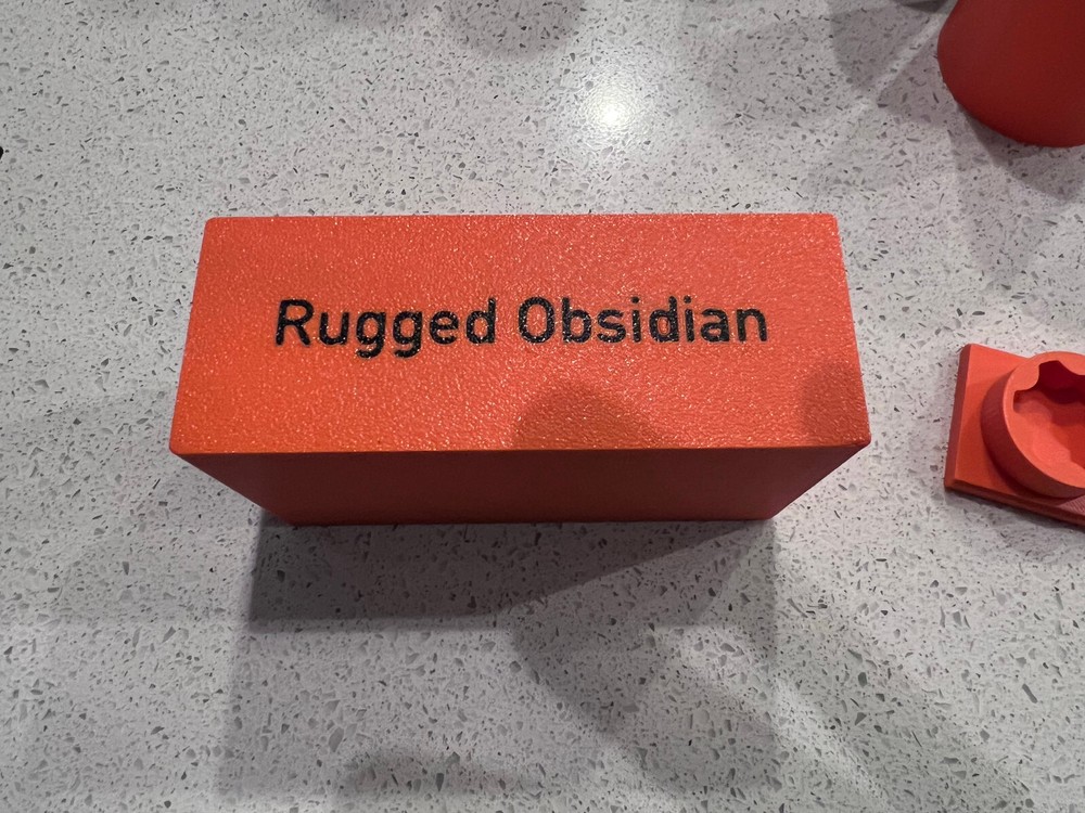 Rugged Obsidian piston/booster storage case and multi-tool