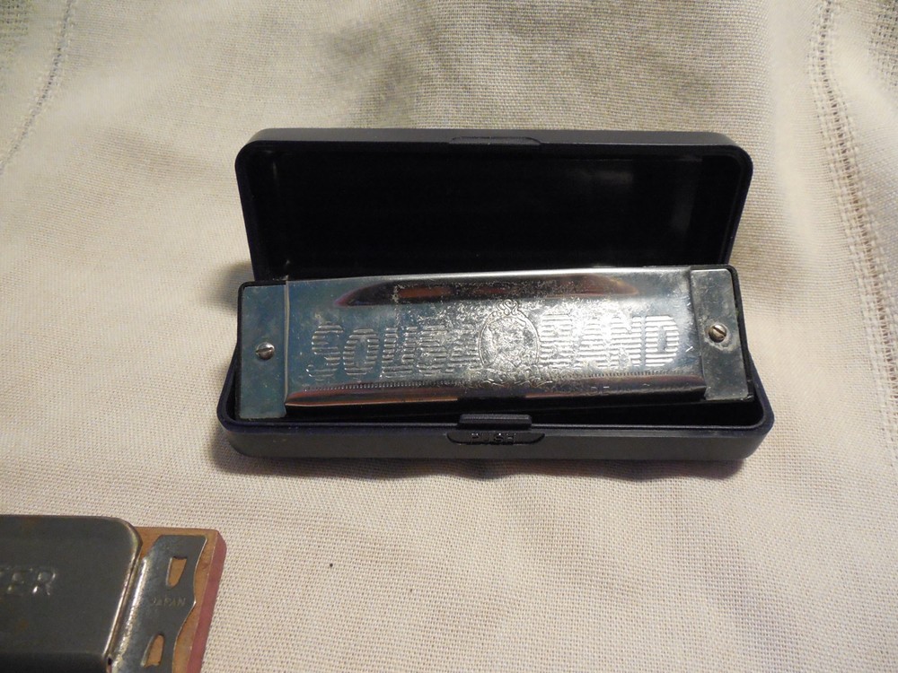 Three harmonicas Sousa band, star, music master