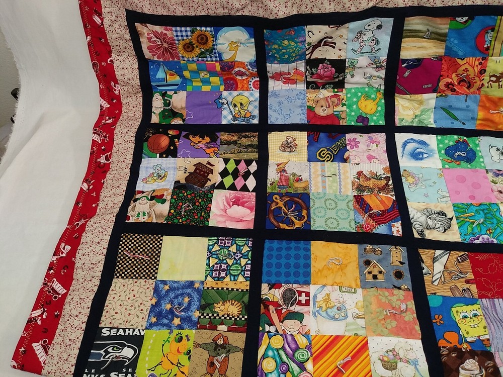 HANDMADE QUILT CHILDRENS 35”x52” multi character