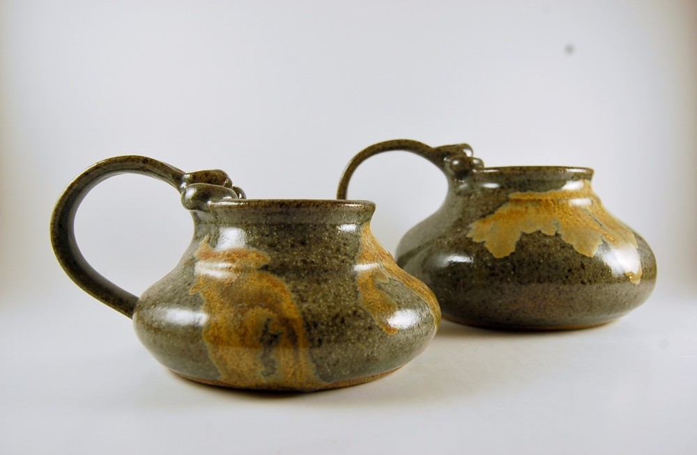 Pottery Pitchers. Two Graceful shaped Earth Tone low Pitchers.