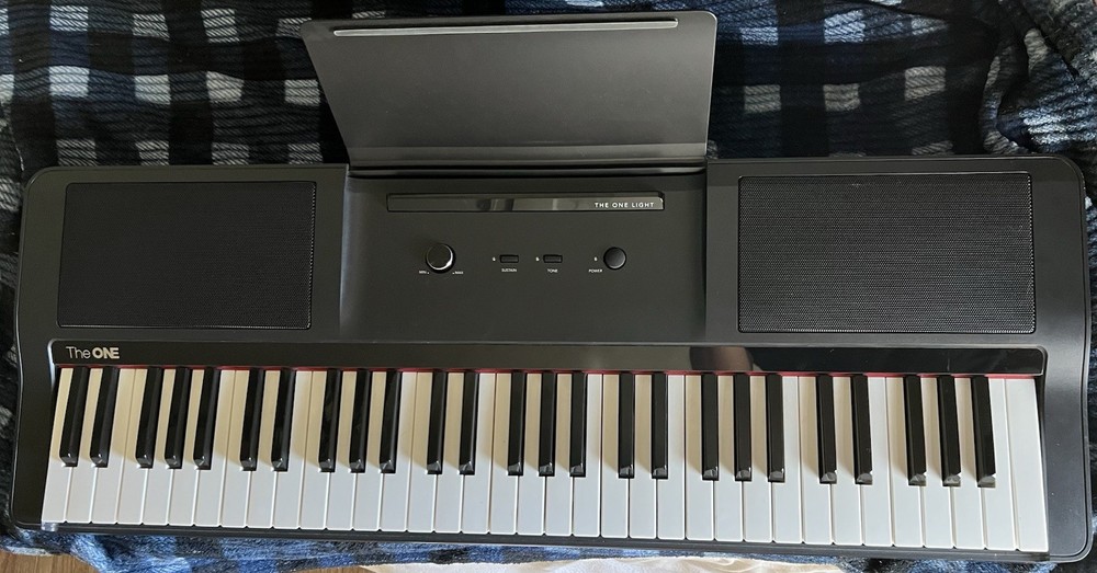 The ONE COLOR Smart Keyboard 61-Key Electronic Keyboard Bluetooth LED Learning