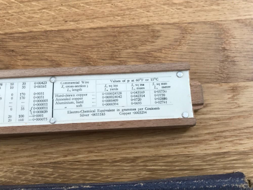 nice old good looking unique electrical slide rule in case