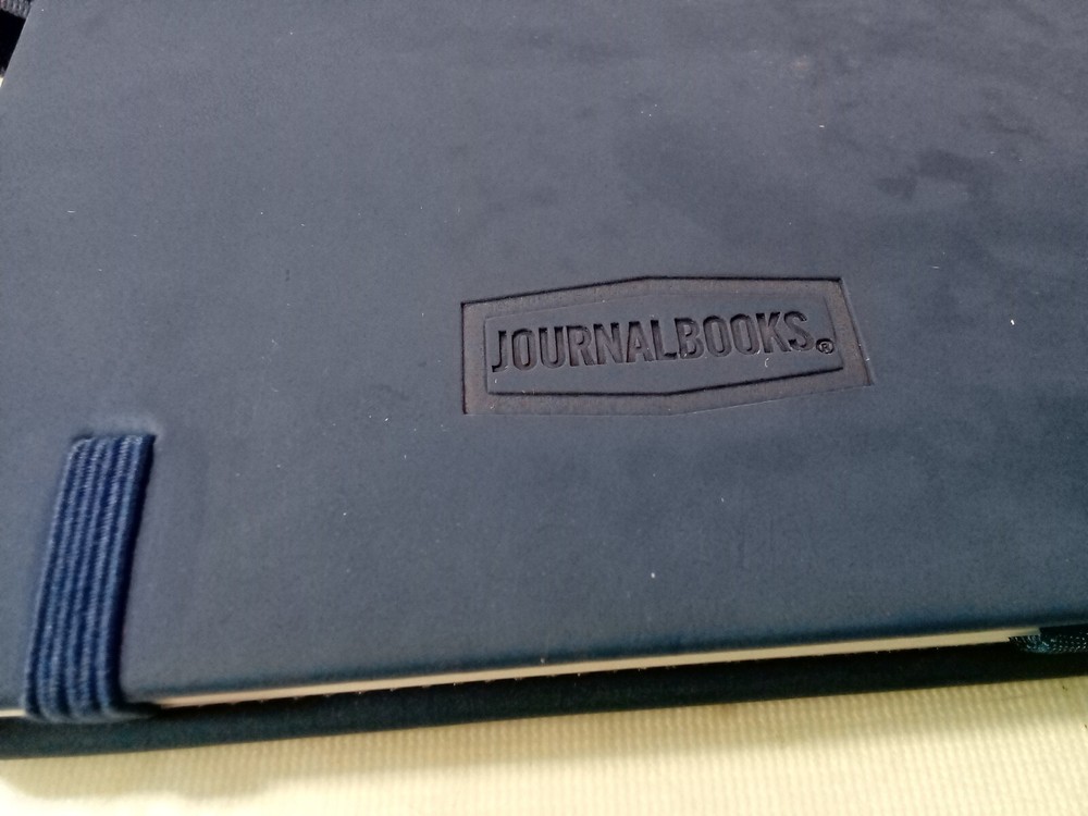 JournalBooks -blue debossed notebook, Flag Symbol