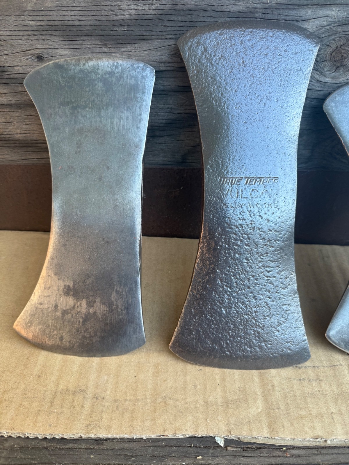 Vintage lot of 4 double bit axes.