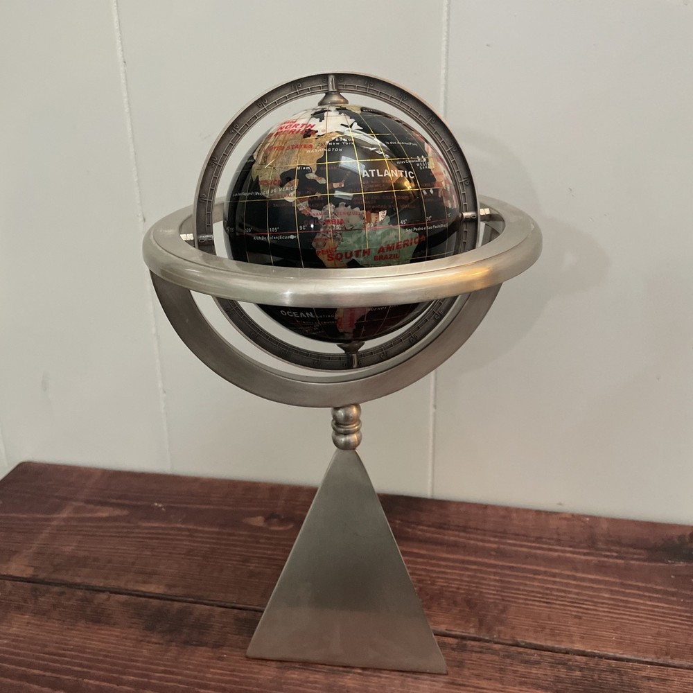 Rotating World Globe On Pyramid