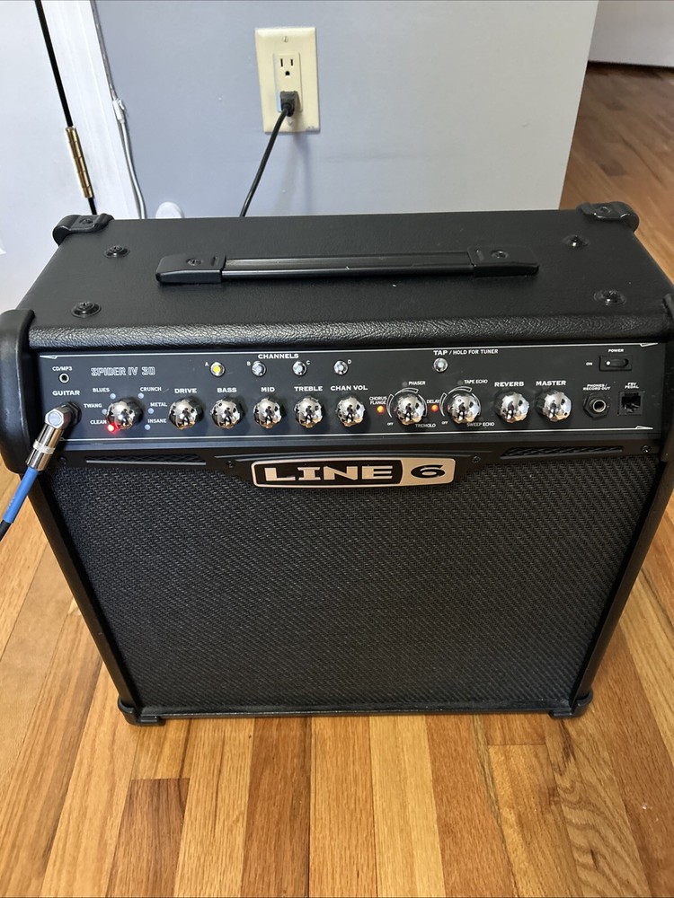 guitar, amp, and stand combo