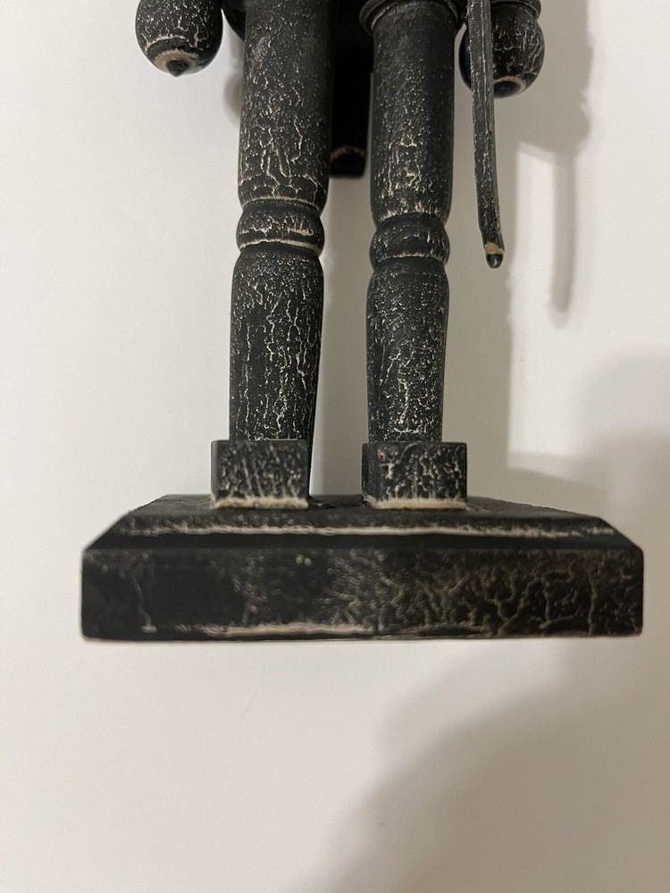 Black washed wooden folk art nutcracker