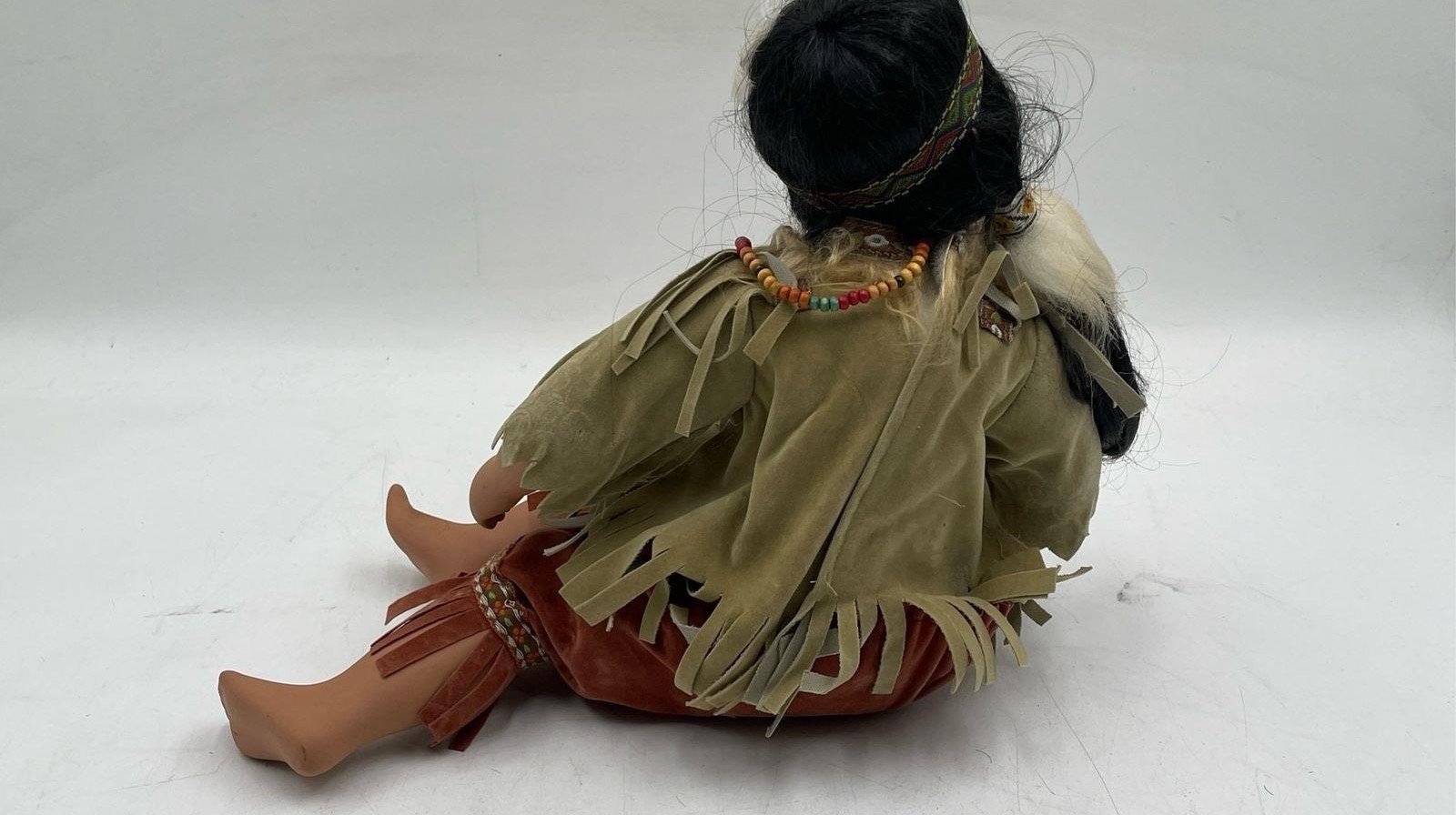 Vintage Native American Girl Doll in Kissing Expression Closed Eyes Sitting Pose