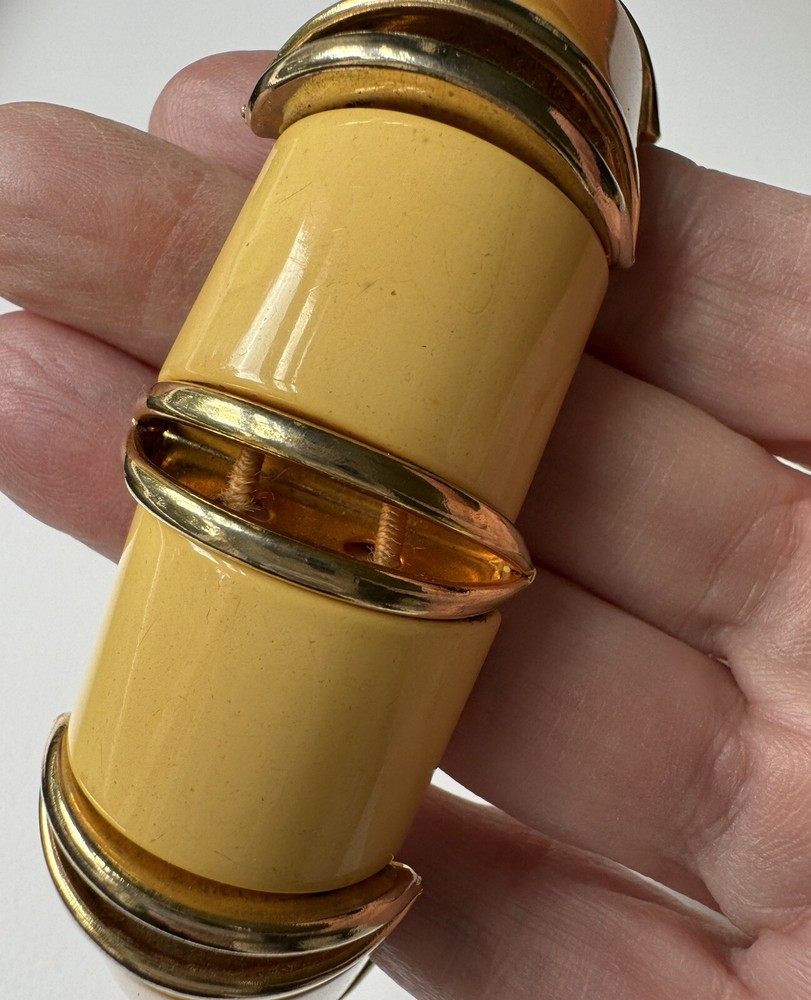 Nice butterscotch bakelite expandable bracelet with deco gold inserts