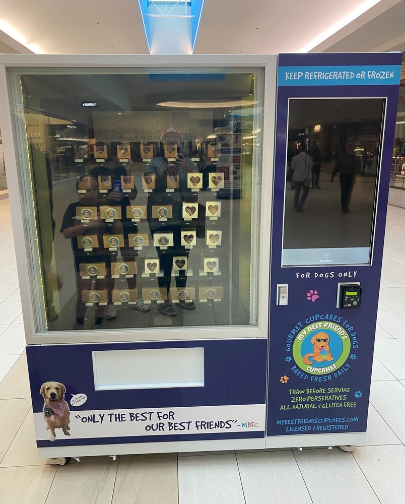 Touchscreen cold vending machine with elevator.