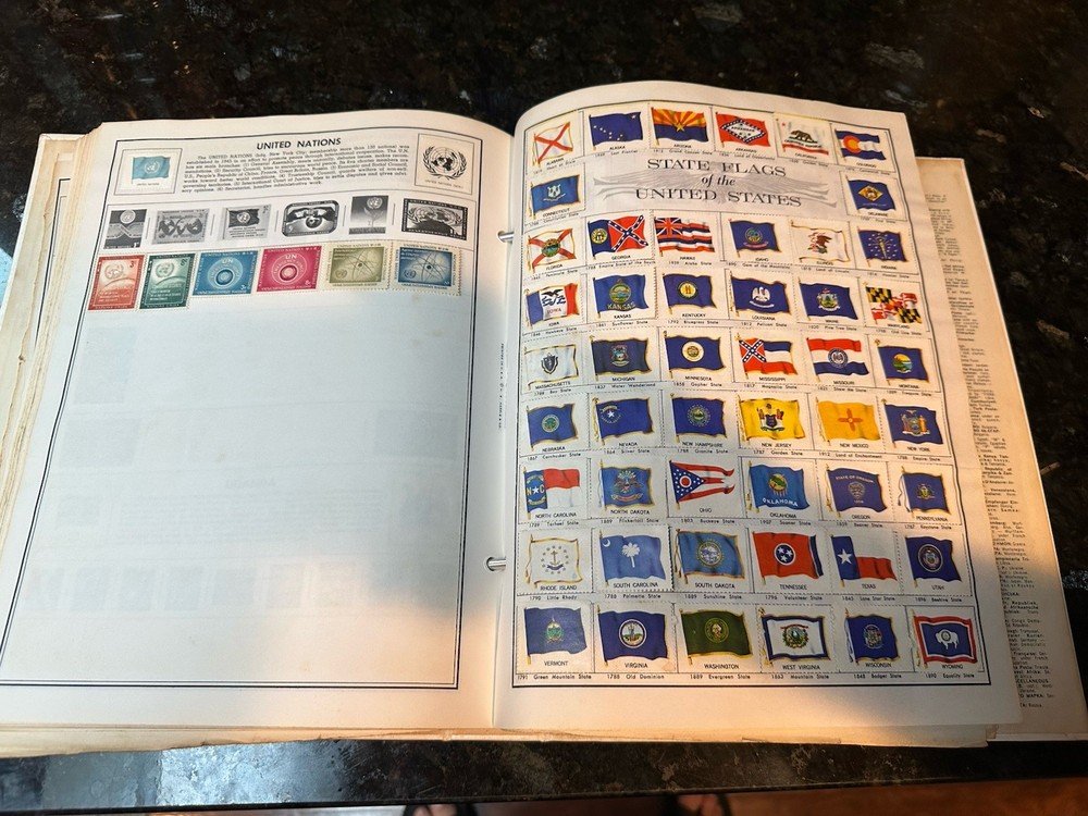 VTG 1977 Traveler Stamp Album With Many Stamps.