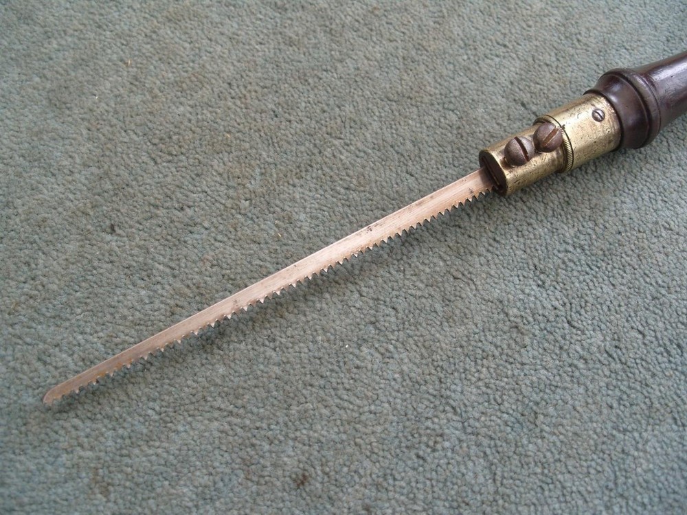 Rosewood handled pad saw.