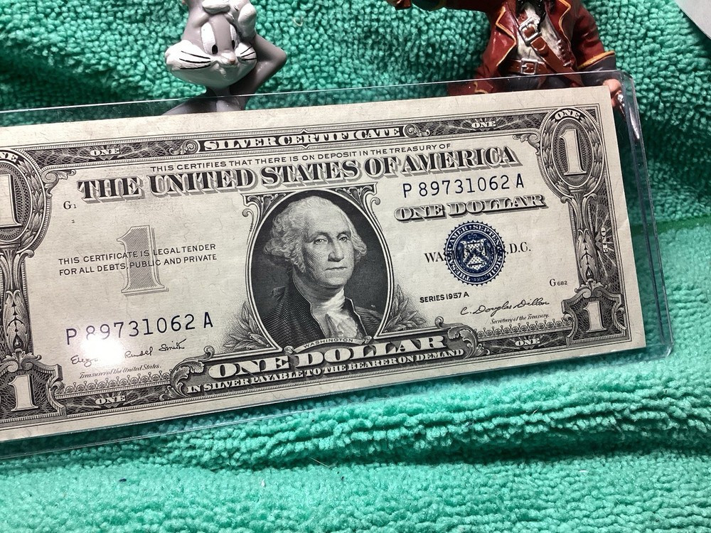 1957 A SILVER CERTIFICATE UNCIRCULATED in RIDIG HOLDER