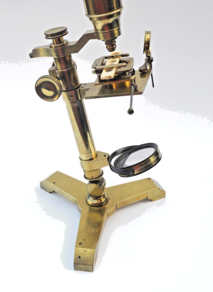 Brass microscope in case.
