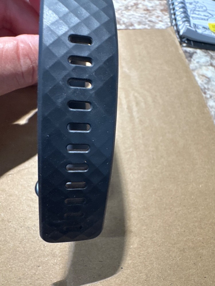 fit bit charge 3 or 4 , tiny ding on bottom of screen