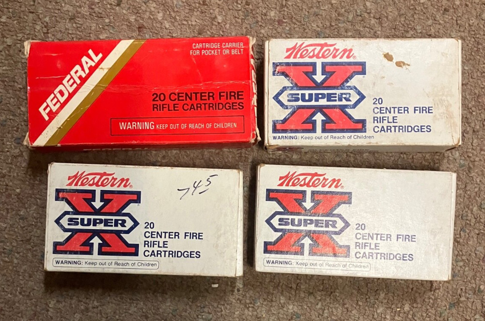 4 Vintage 243 Winchester empty boxes complete with shell holders