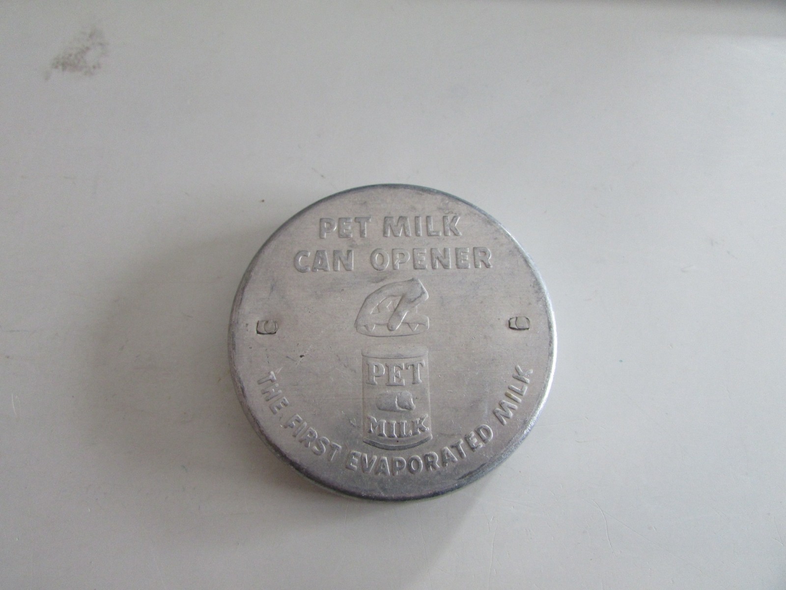 VTG 1940s PET Milk Can Opener Cover THE FIRST EVAPORATED MIILK 3” Aluminum Metal