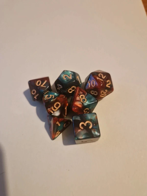 Green and red marble effect polyhedral dice set