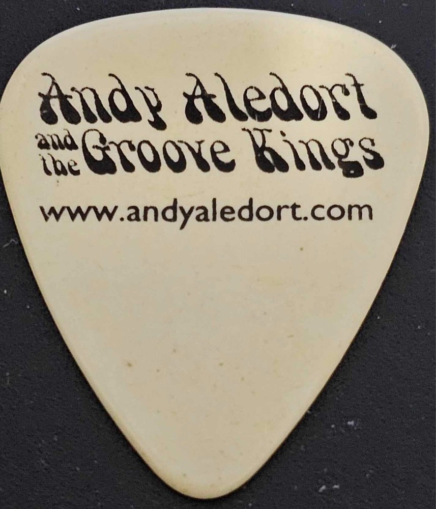 Andy Aledort white guitar pick