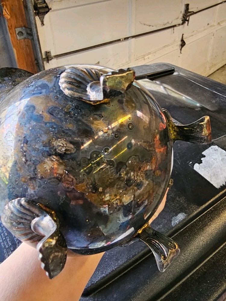 This vintage collectible is a silver-plated, footed pitcher