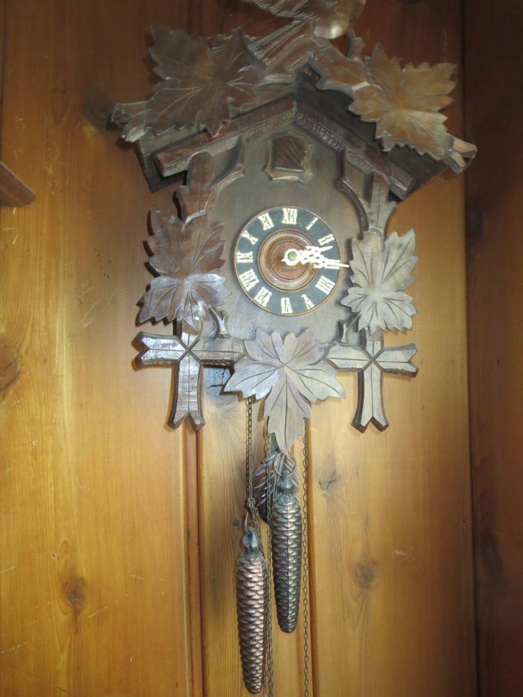 Old Cuckoo clock with articulated bird