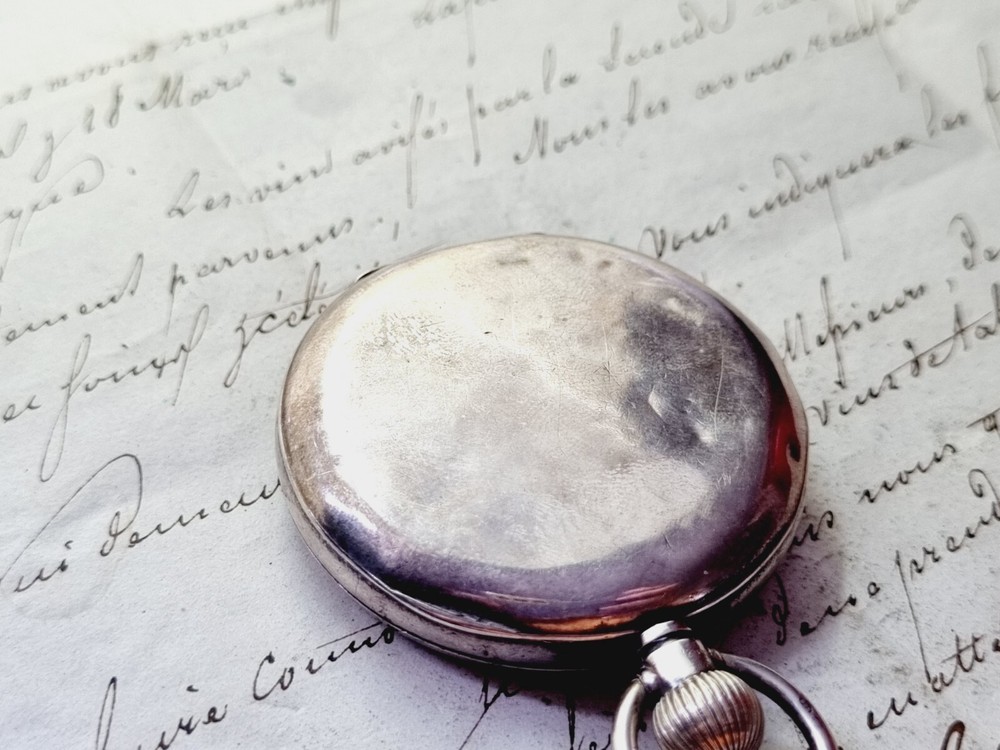 silver open face pocket watch