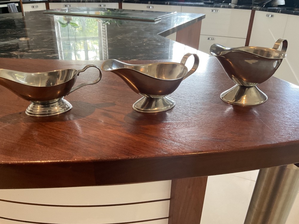 THREE SILVER COLOUR SAUCE BOATS GRADUATED