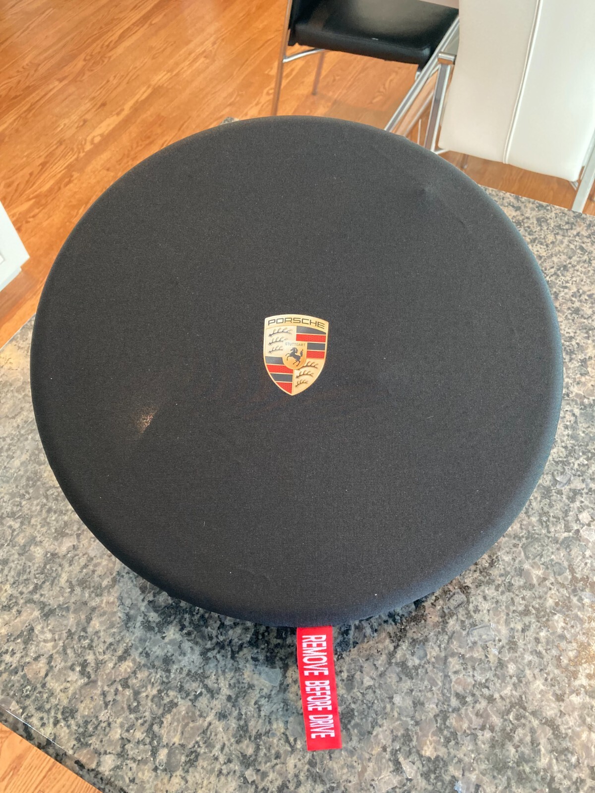 PORSCHE DESIGN OEM FACTORY STEERING WHEEL PROTECTIVE COVER IN BLACK W/CREST. NEW