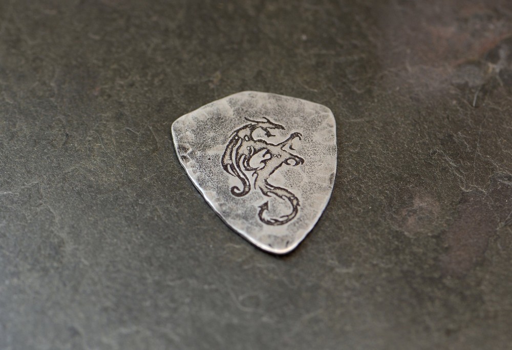 Sterling silver dragon guitar pick in shield shape