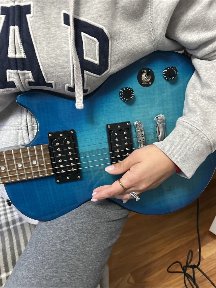 guitar, amp, and stand combo