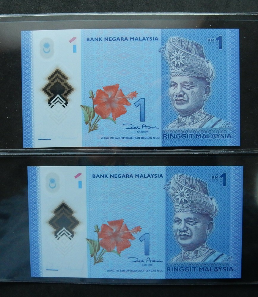 Malaysia $1, 2 notes same serial number, different prefix. Fancy binary 9999944
