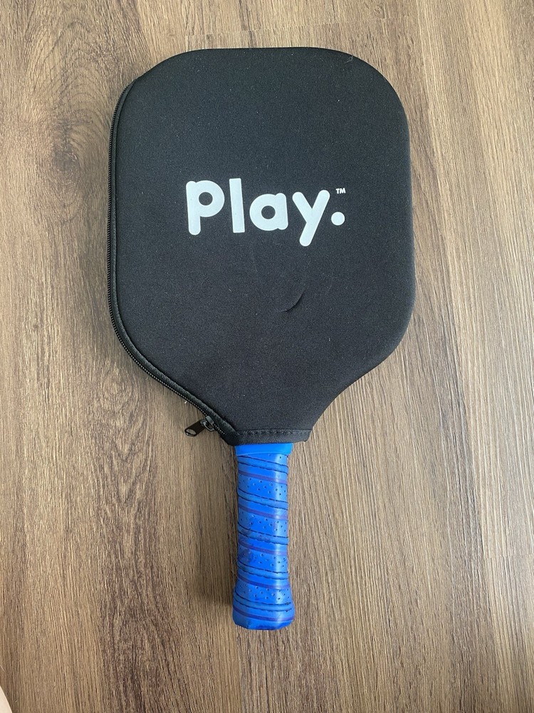 Play. Blue Pickleball Paddle Checkered Pattern Has Slight Wear On Handle