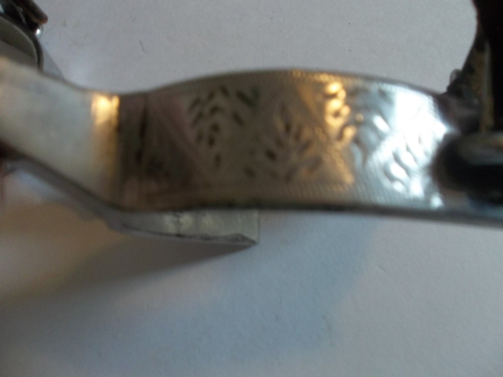 SPURS WITH DESIGN STAMPED ON SIDE #62