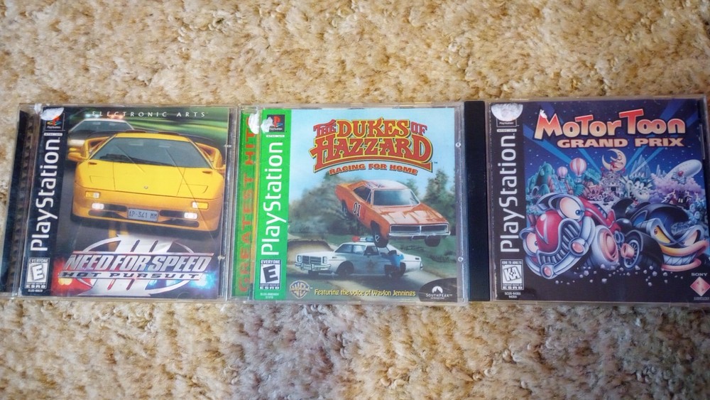 PlayStation 1 console with games