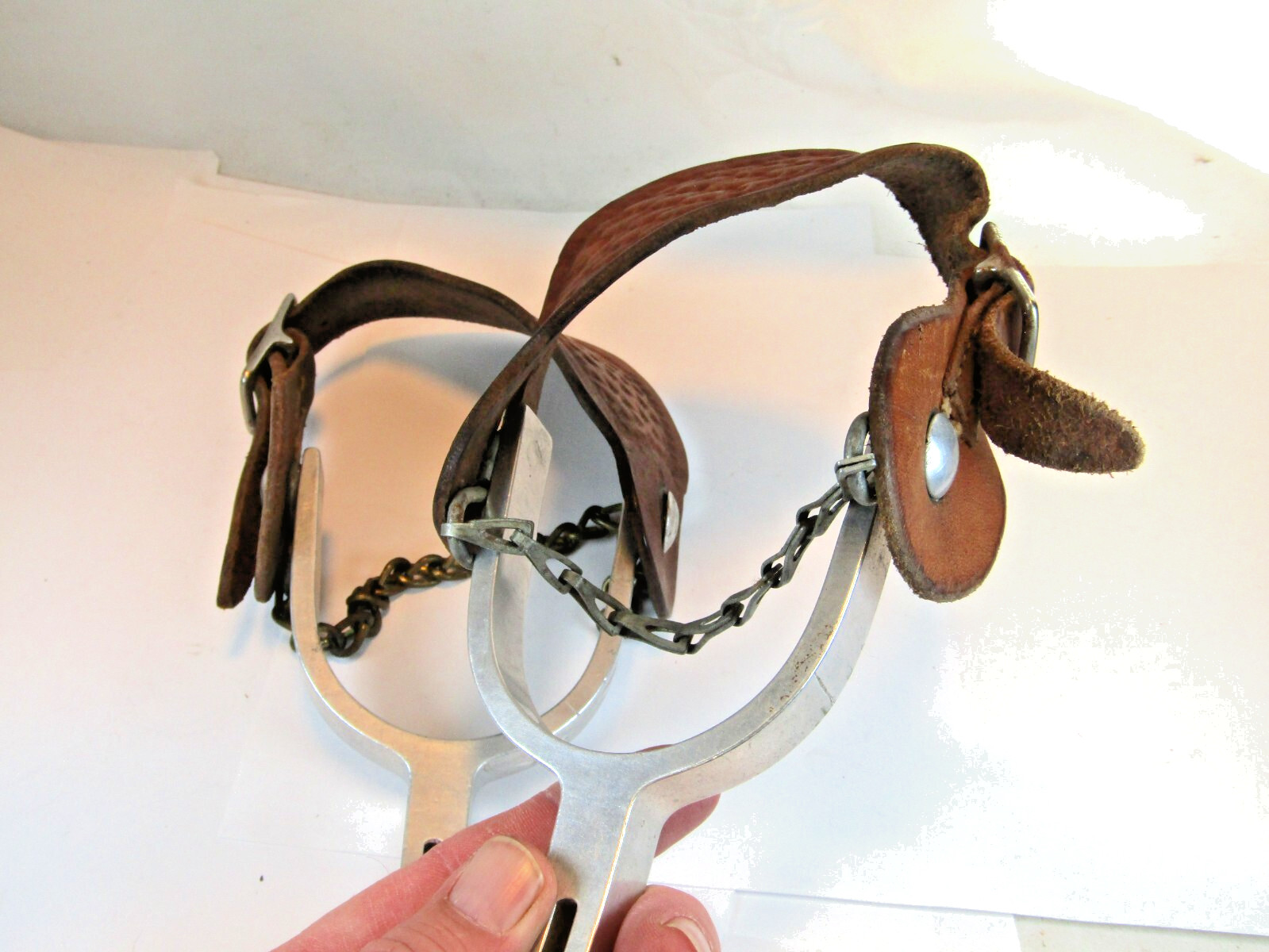 PAIR OF UNMARKED ENGRAVED ALUMINUM AIRPLANE METAL RIDING SPURS W/ STRAPS