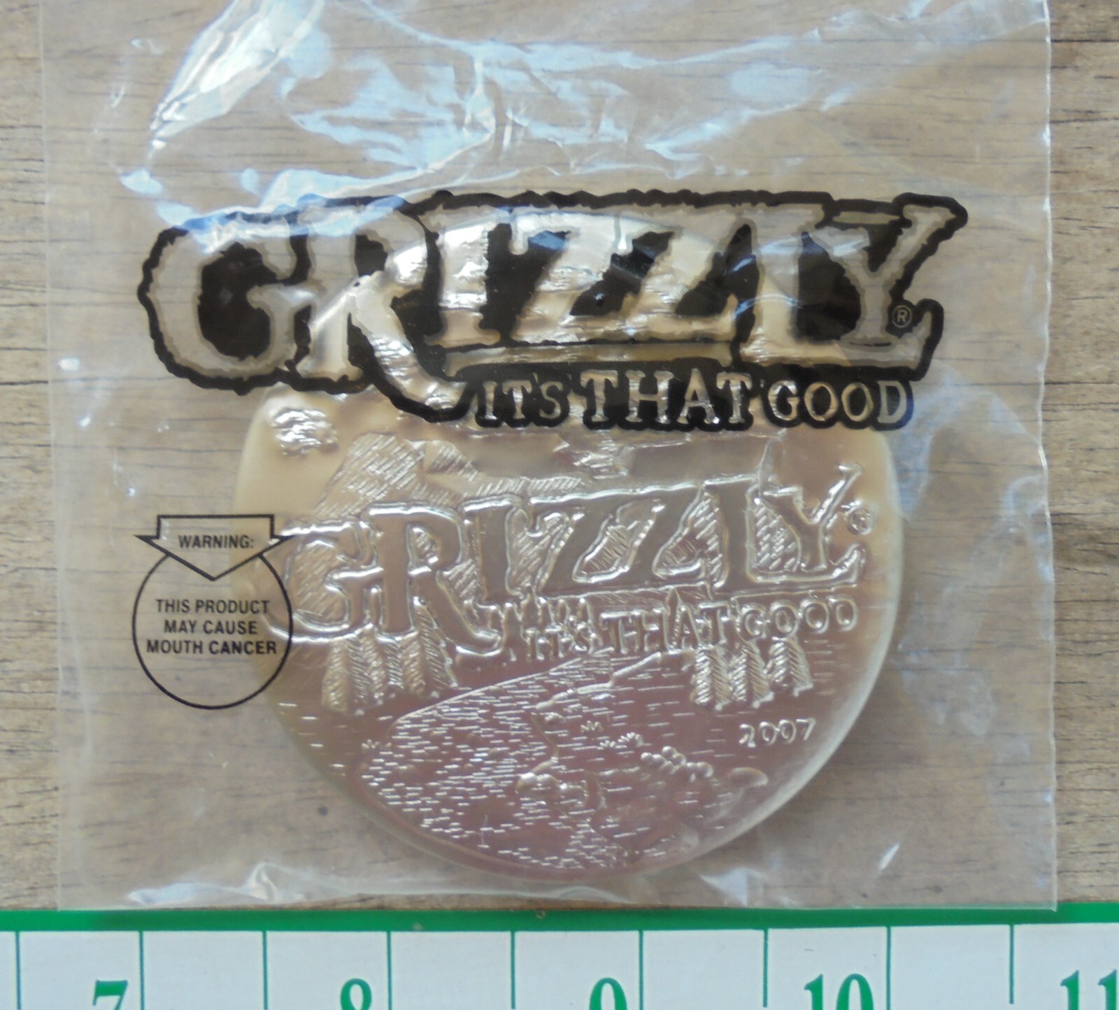 2007 Grizzly Premium Metal Snuff Can Lid "IT's THAT GOOD"-new/unused