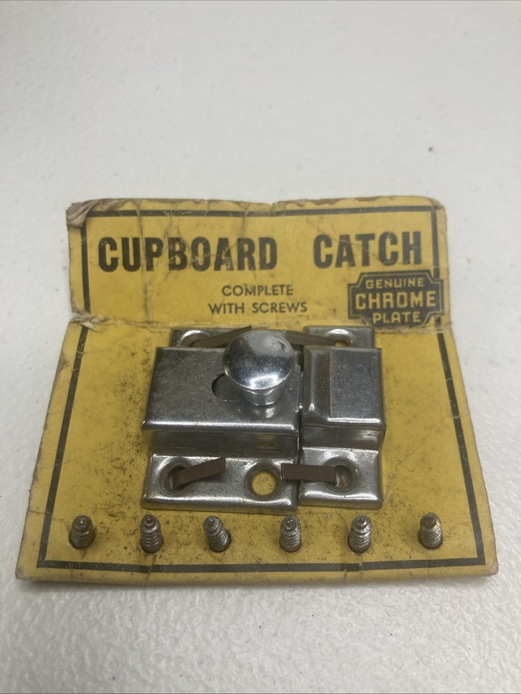 NOS- vintage chrome-plated cupboard catch.