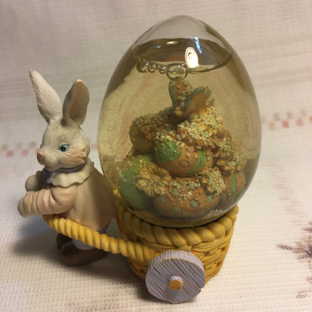 Rabbit Pulling Cart Snow globe Filled With Easter Eggs. Super Cute