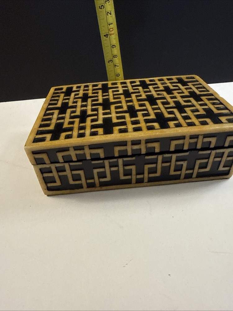 A decorative box with geometric inlay pattern, sold by Sears.