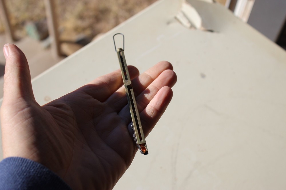 Brass straight-line percussion capper