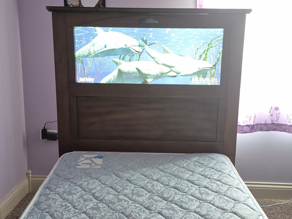 Wooden twin bed with remote controlled LED light