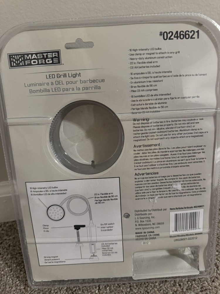Master Forge LED grill light with a flexible arm, powered by three AA batteries