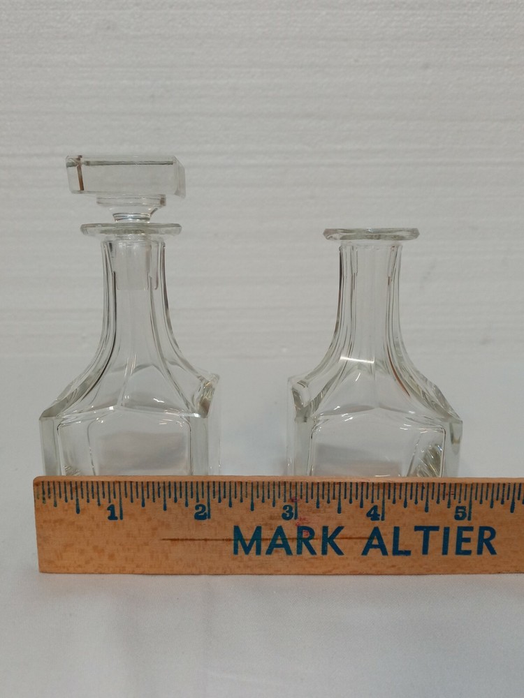 Two 4in Clear Glass Bottles One Stopper